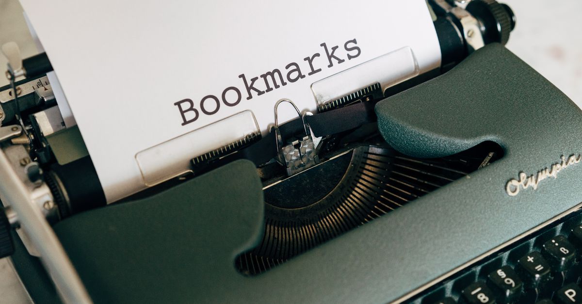 Close-up of a vintage typewriter with "Bookmarks" typed on paper.