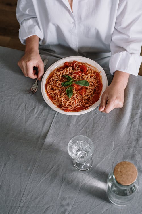 Free A Plate Of Spaghetti On Table Stock Photo