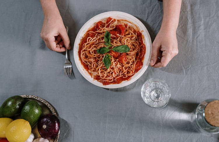 A Plate Of Spaghetti On Table