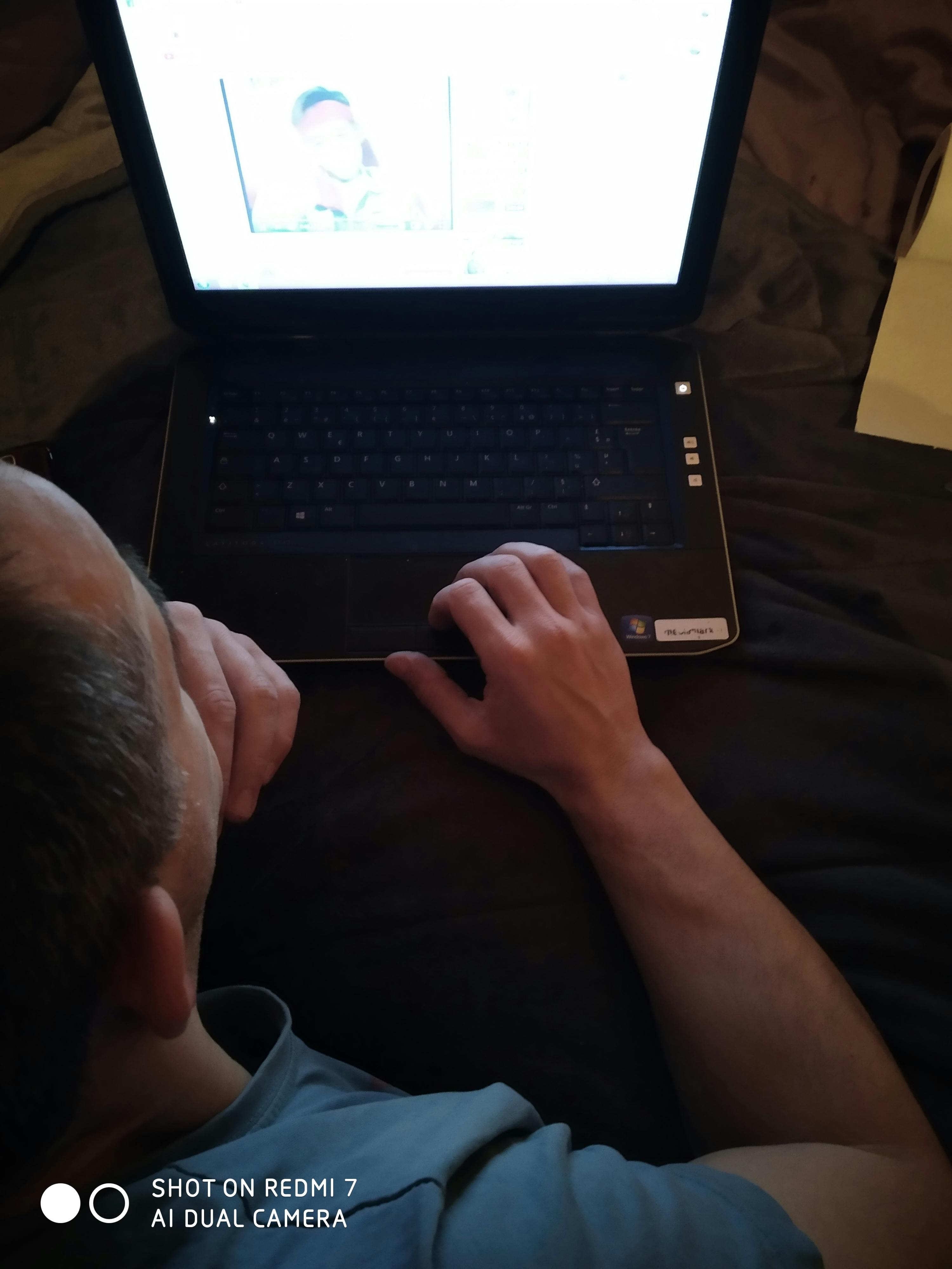 A person wearing headphones and speaking into a microphone