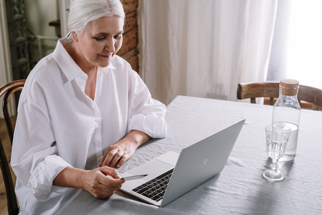 Free An Old Woman Using A Laptop Stock Photo