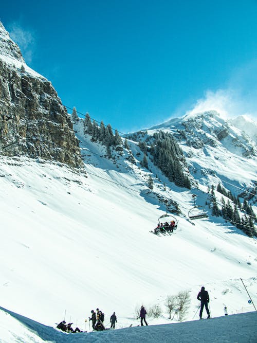 People on Ski Lift on  Snow Covered Mountain