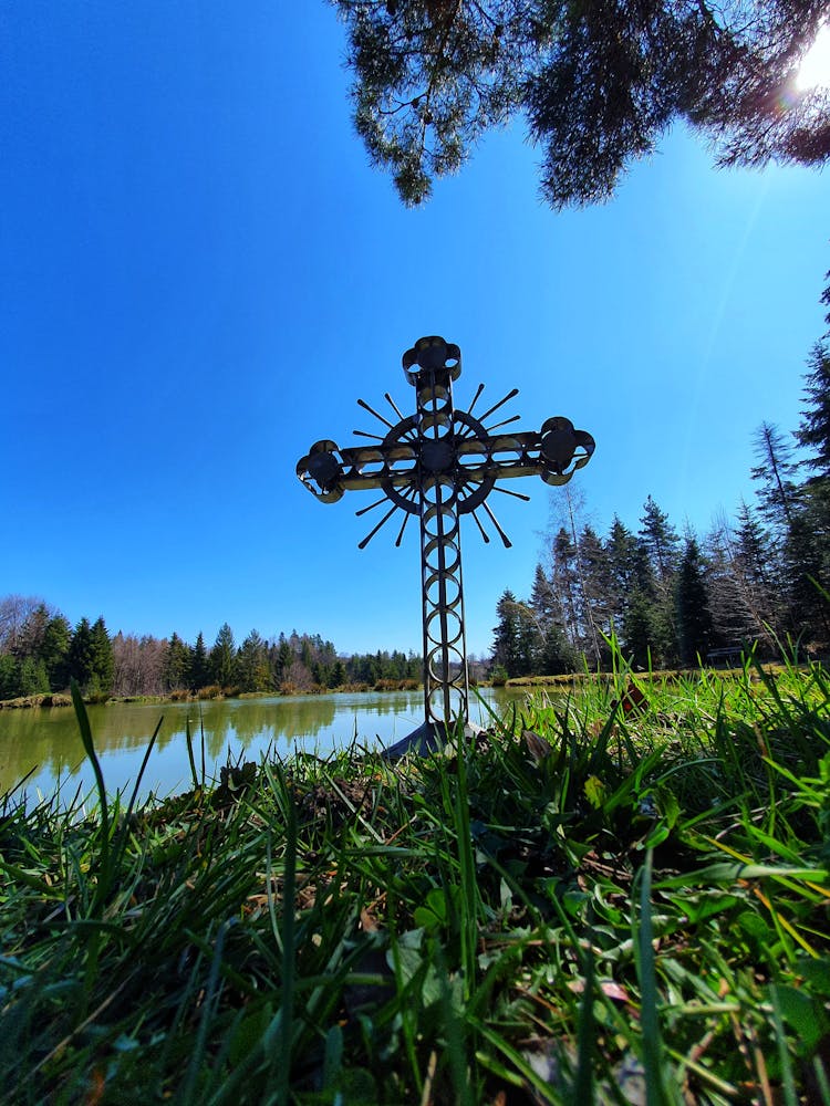 Christian Cross On Coast Of River