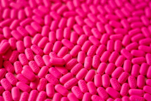 Pink Medicine Tablets In Close-up View