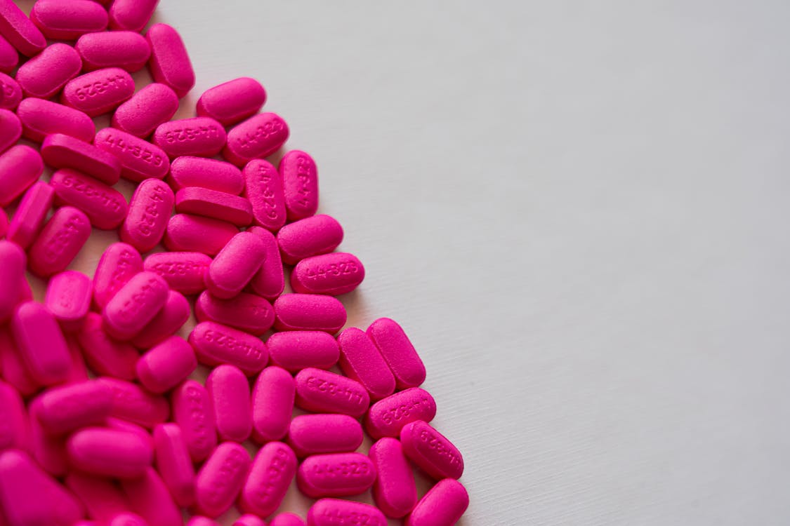 Pink Heart Shaped Candies on White Surface