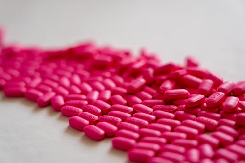 Pink Medicines on White Textile