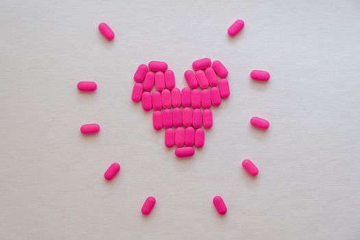 Pink Heart Shaped Medicines on White Surface