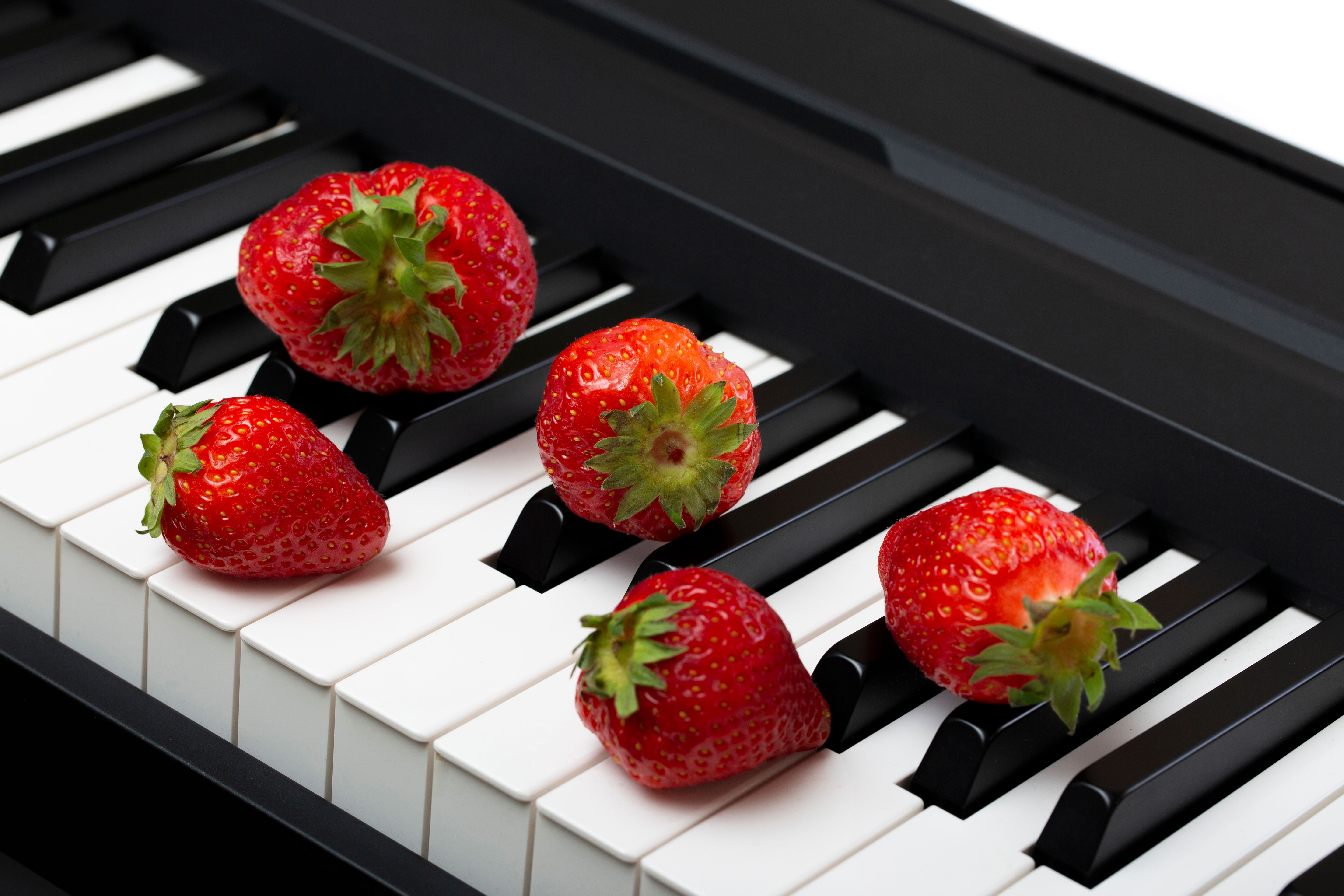 Fresh Strawberries on Piano Keys · Free Stock Photo