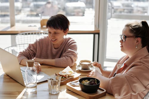 Free Women at the Shop Having a Meeting Stock Photo