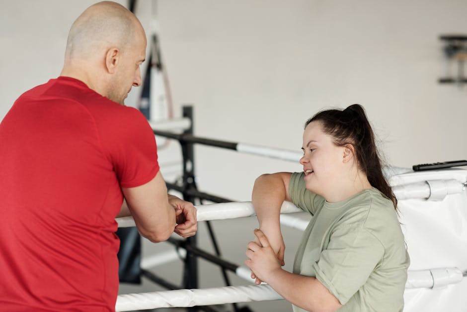 person talking to a trainer during a consultation - athletic training gyms near me person talking to a trainer during a consultation - athletic training gyms near me