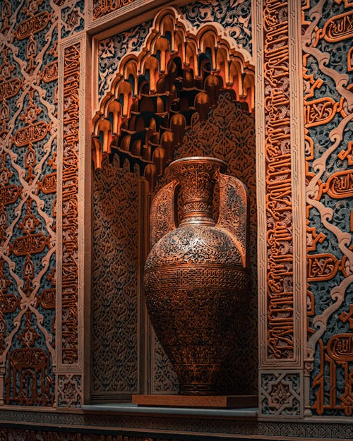 Free Interior of Real Casino de Murcia in Costa Blanca including multi colored Arabic script on wall and different ornaments composing with luxurious antique amphora in alcove Stock Photo