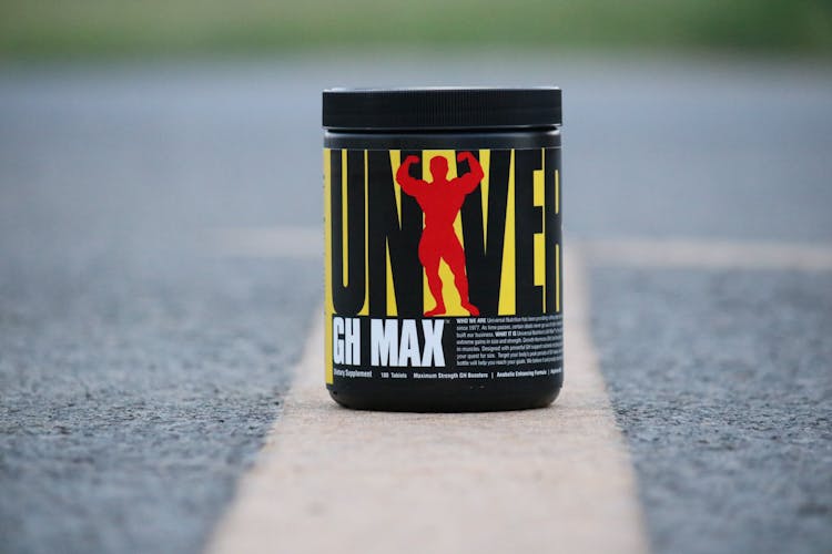 Black And Yellow Labeled Container Universal Nutrition GH Max
