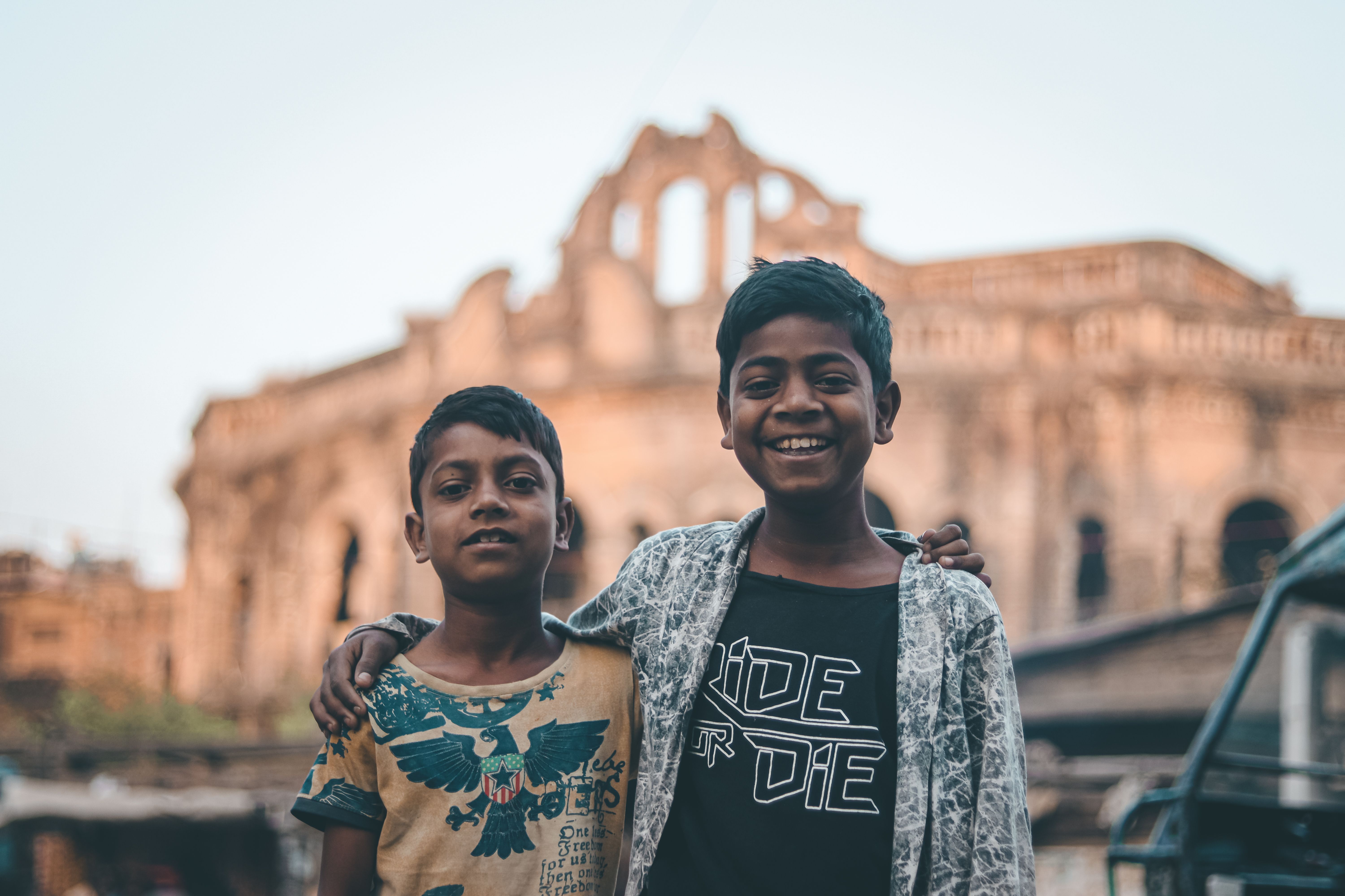 Happy Kids with Historic Building Background · Free Stock Photo