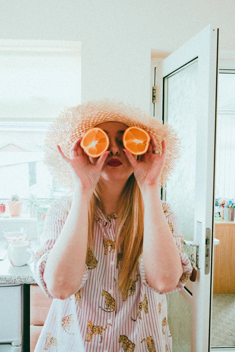 Woman Having Fun With Citrus At Home