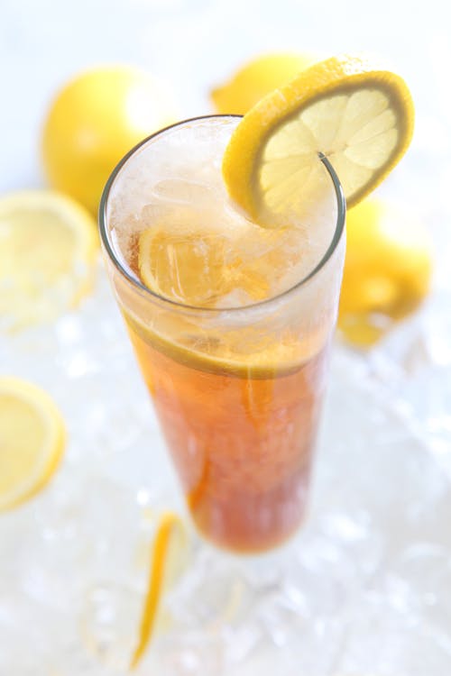Free Cold Drinks Served on Clear Highball Glass With Lemon Garnish Stock Photo