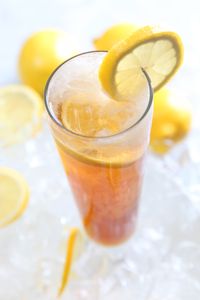 Tall glass of iced lemon tea over ice — photo by Pixabay on Pexels