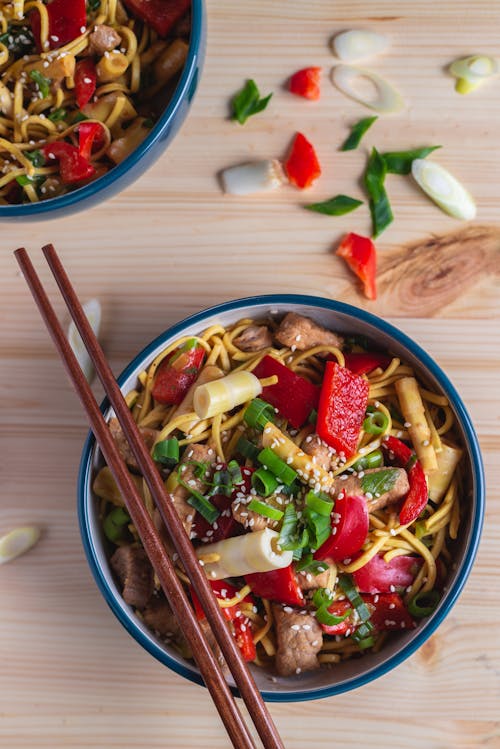 Free Brown Chopsticks on Brown Bowl Stock Photo