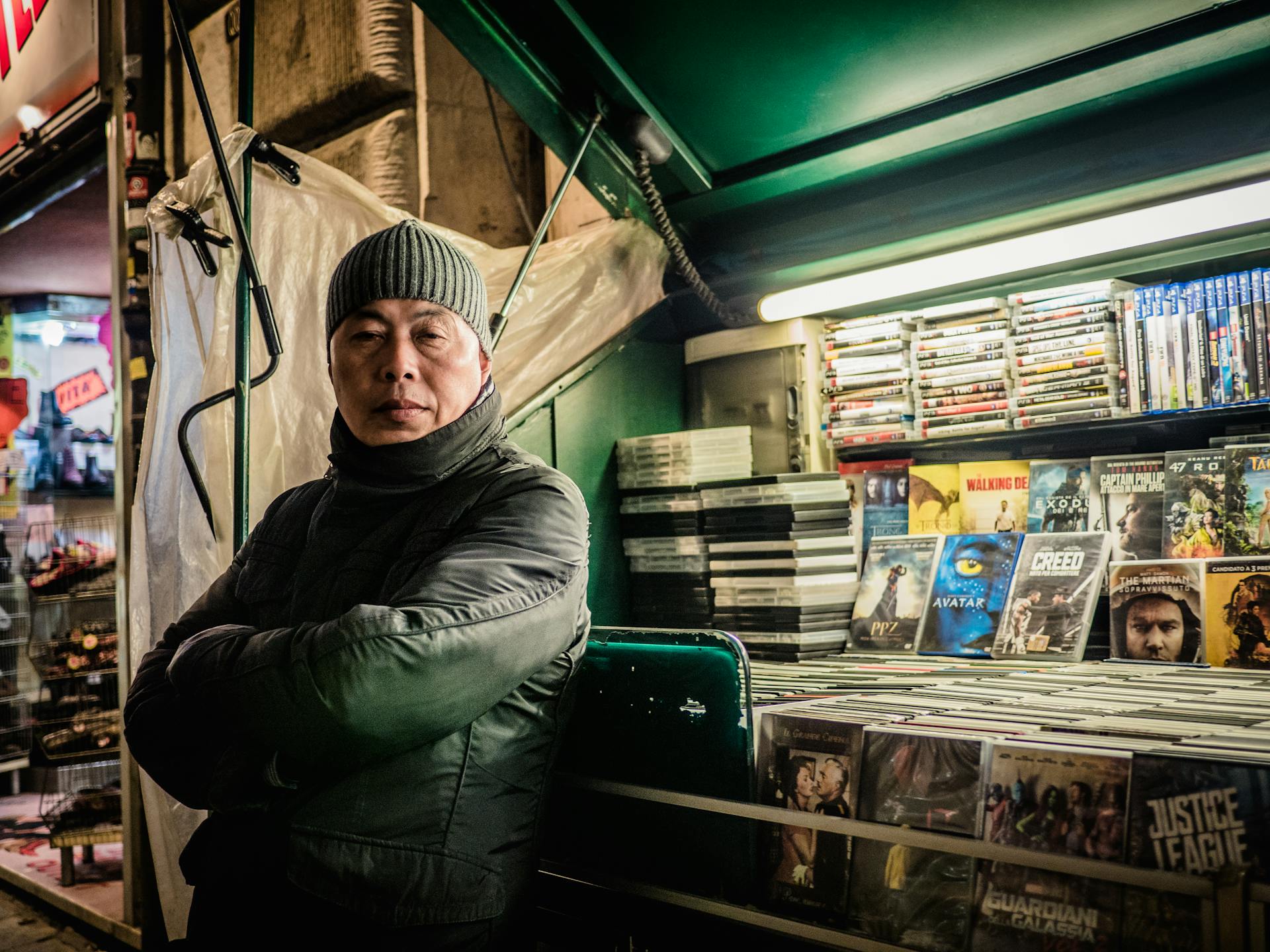 Asian man selling DVD discs