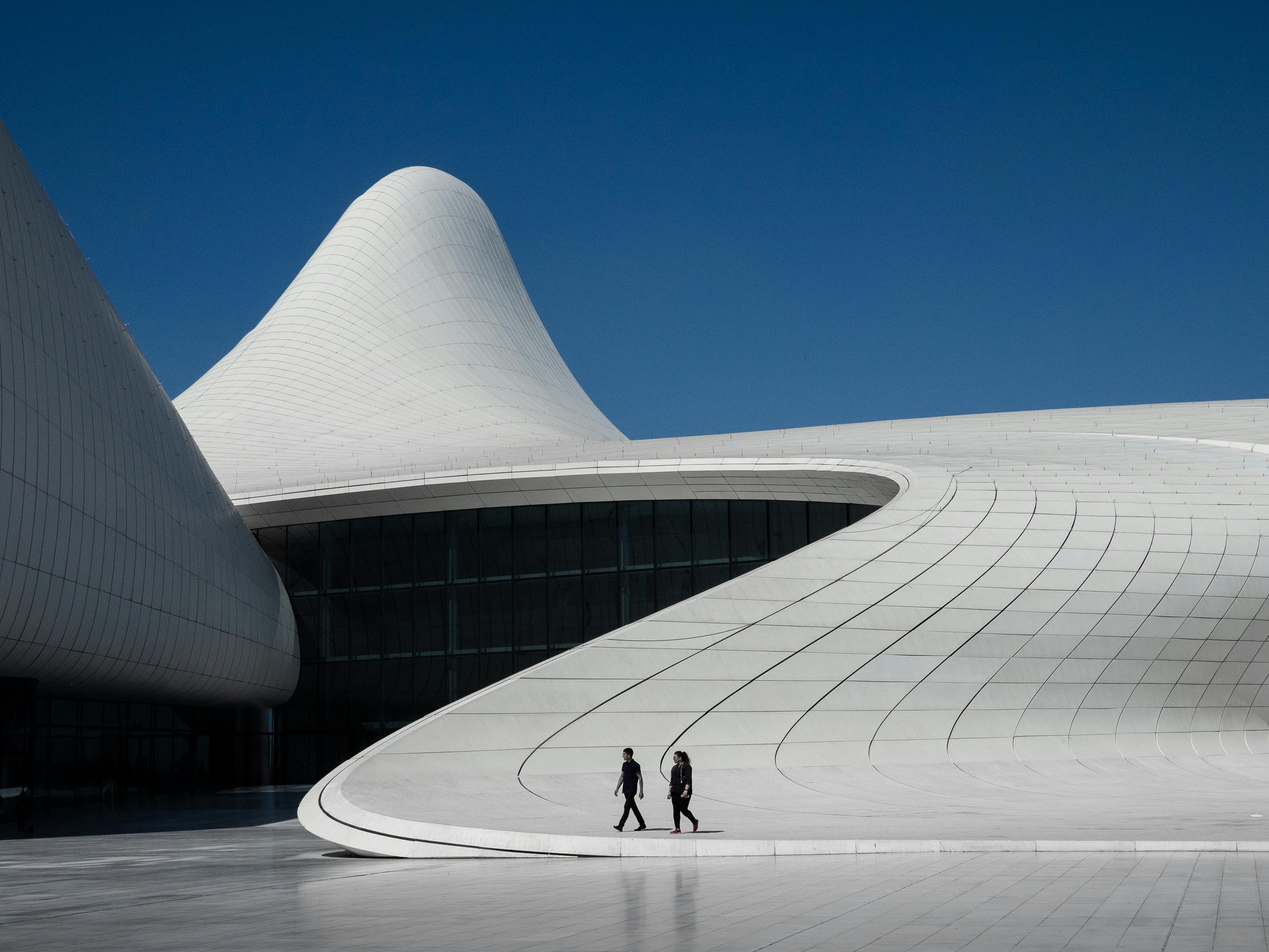 People walking outside modern building · Free Stock Photo