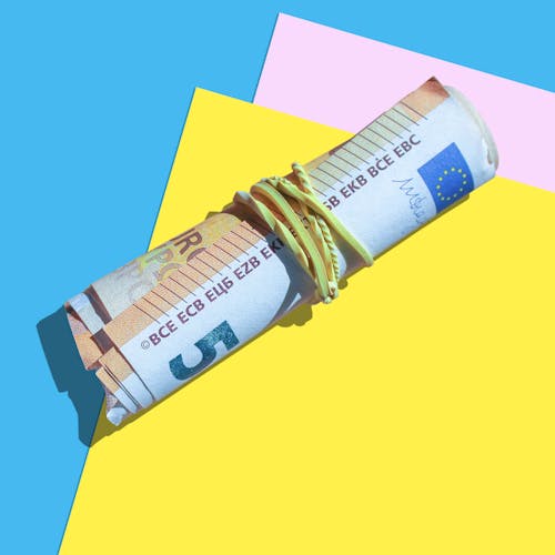 Cash on Yellow and Blue Surface