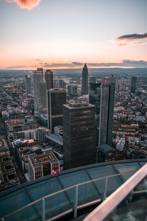 Free A stunning aerial view of Frankfurt's skyline during sunset, showcasing modern skyscrapers and architecture. Stock Photo