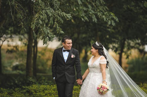 Free Man in Black Suit and Woman in White Wedding Dress Stock Photo
