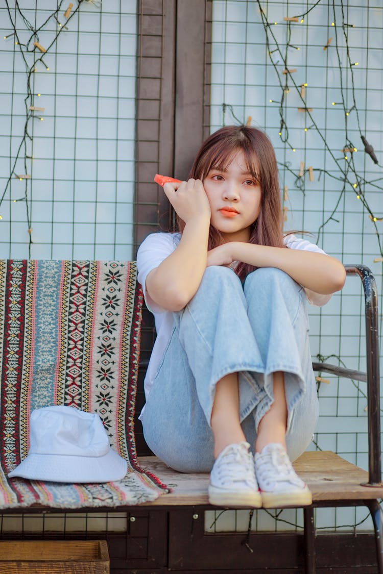 Thoughtful Asian Female With Watermelon