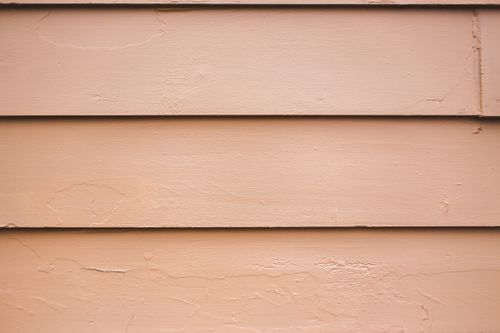 Free Close-up of a textured wooden wall panel perfect for background or texture use. Stock Photo