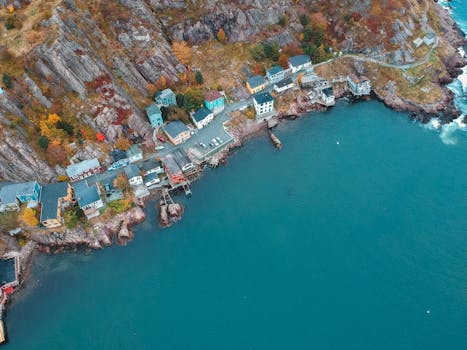 Drone shot of colorful homes along the rocky coastline in St. John's, NL, Canada.