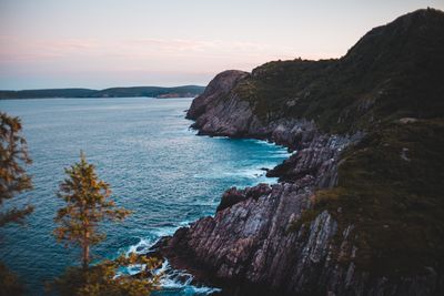 Headland and open water at dusk, photo by Erik Mclean on Pexels