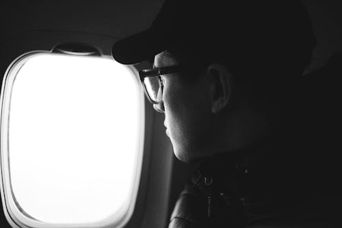 Grayscale Photo of Man Wearing Black Framed Eyeglasses