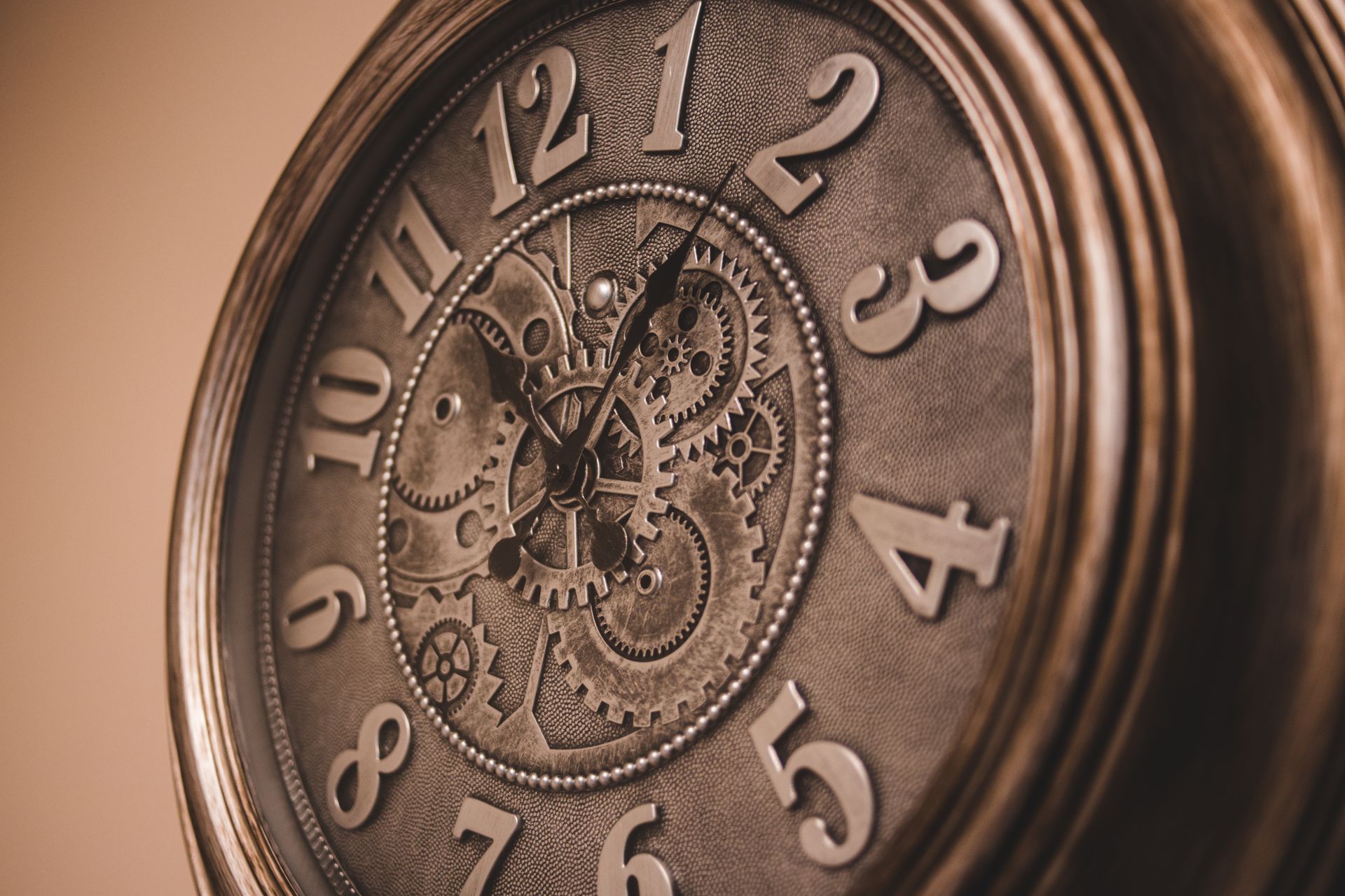 Close-up of a vintage wall clock showcasing intricate mechanical gears and classic design.