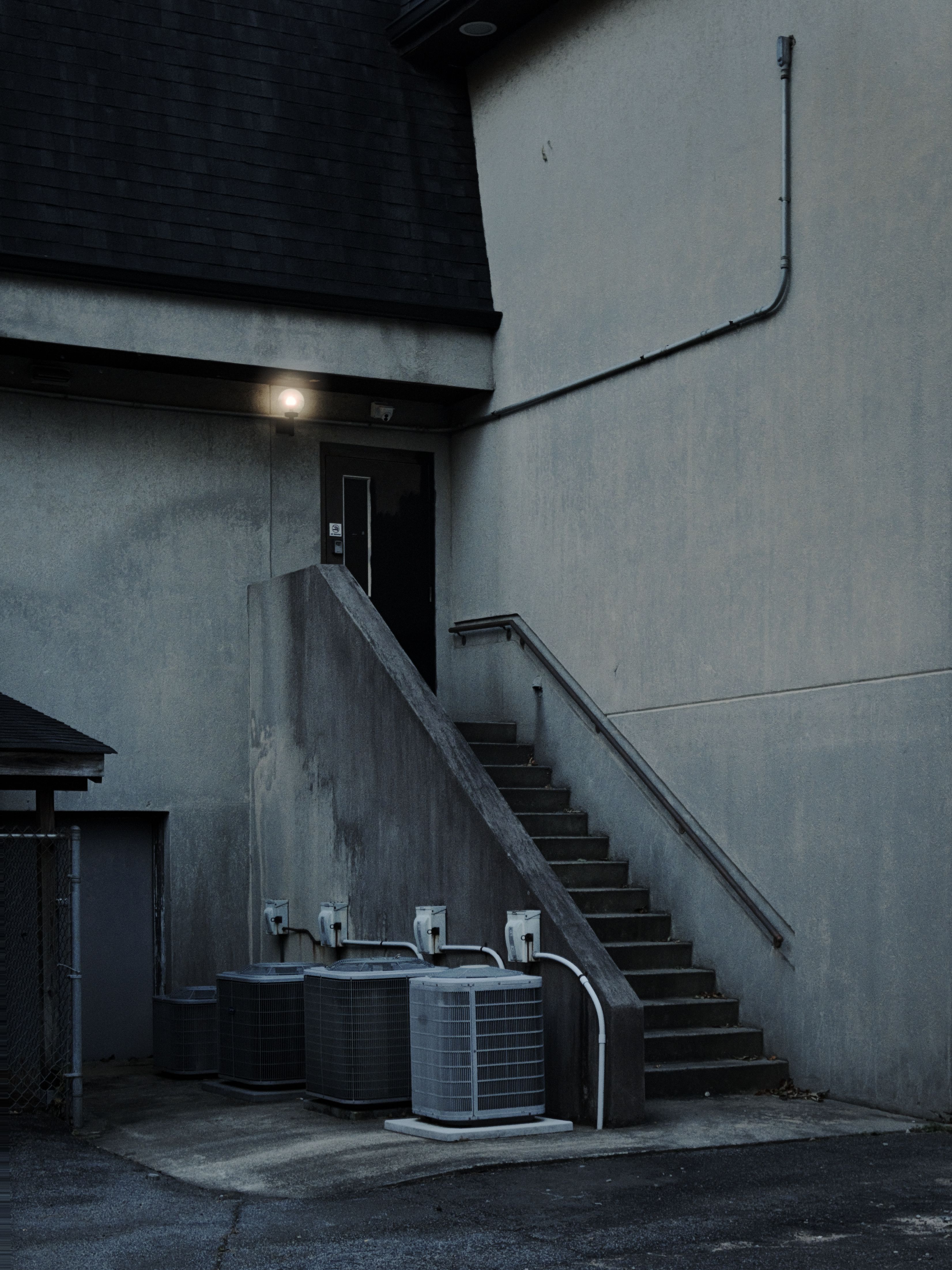 Urban Building Exterior with Staircase at Night · Free Stock Photo