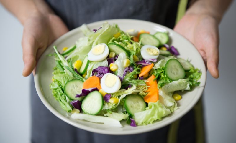 egg salad in small lettuce cups with paprika