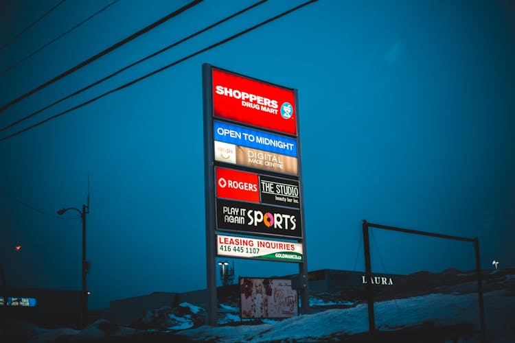 Glowing Signboard Of Shopping Mall In Winter