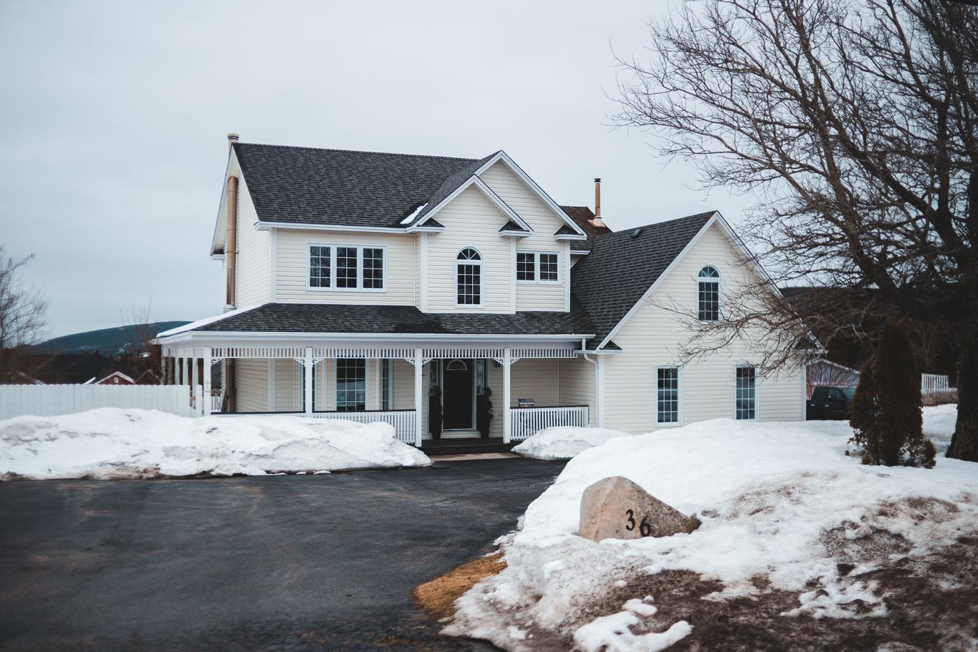 Residential home on a quiet suburban street during a cold winter day