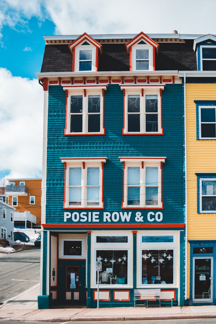 Old Colorful Shop Building Near City Road In Daylight