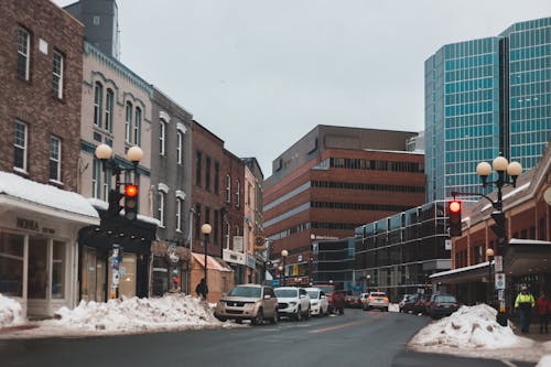 Cars Parked on Side of Road Near Buildings