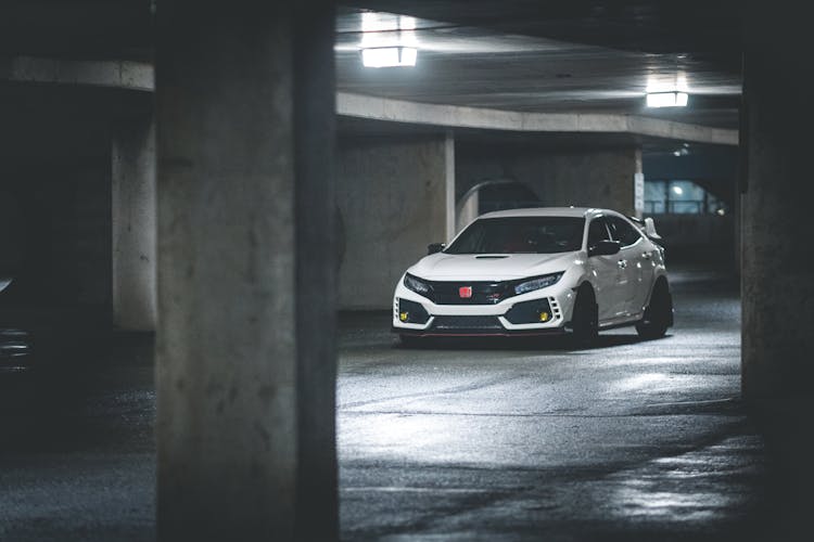 Modern Car Driving In Parking Building At Night