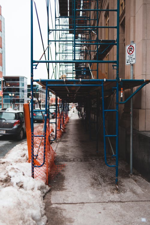 Metal construction on city street during old building restoration