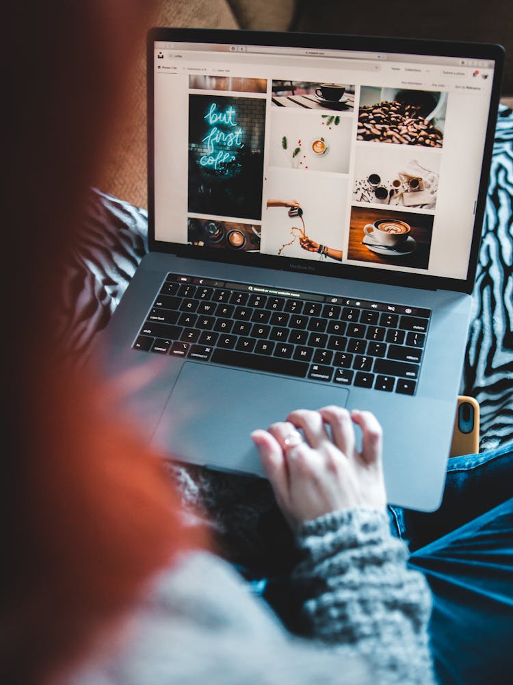 Faceless Woman Surfing Internet On Laptop With Images On Screen