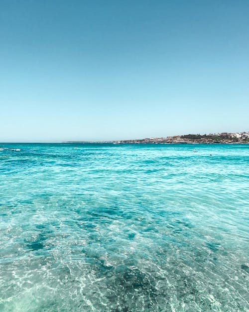 Безкоштовне стокове фото на тему «берег моря, бірюза, блакитне небо»