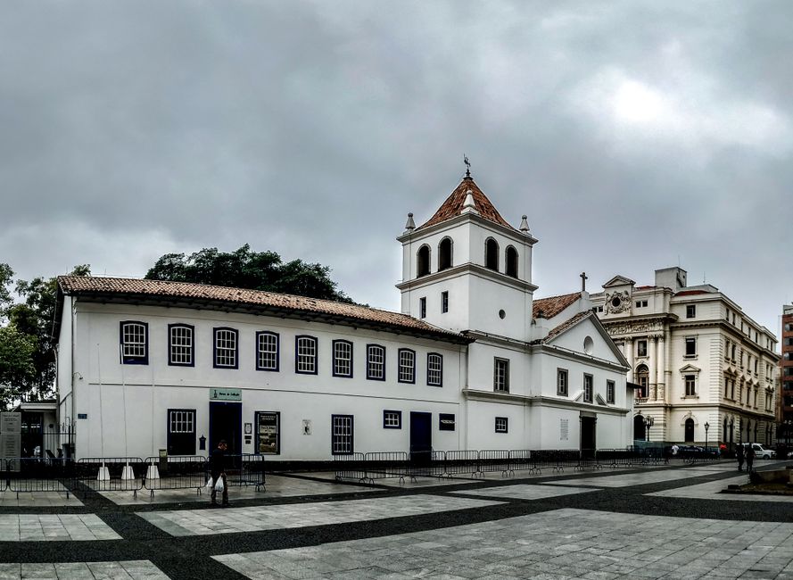 A historic church building in São Paulo, Brazil, captured under a cloudy sky, showcasing colonial architecture.