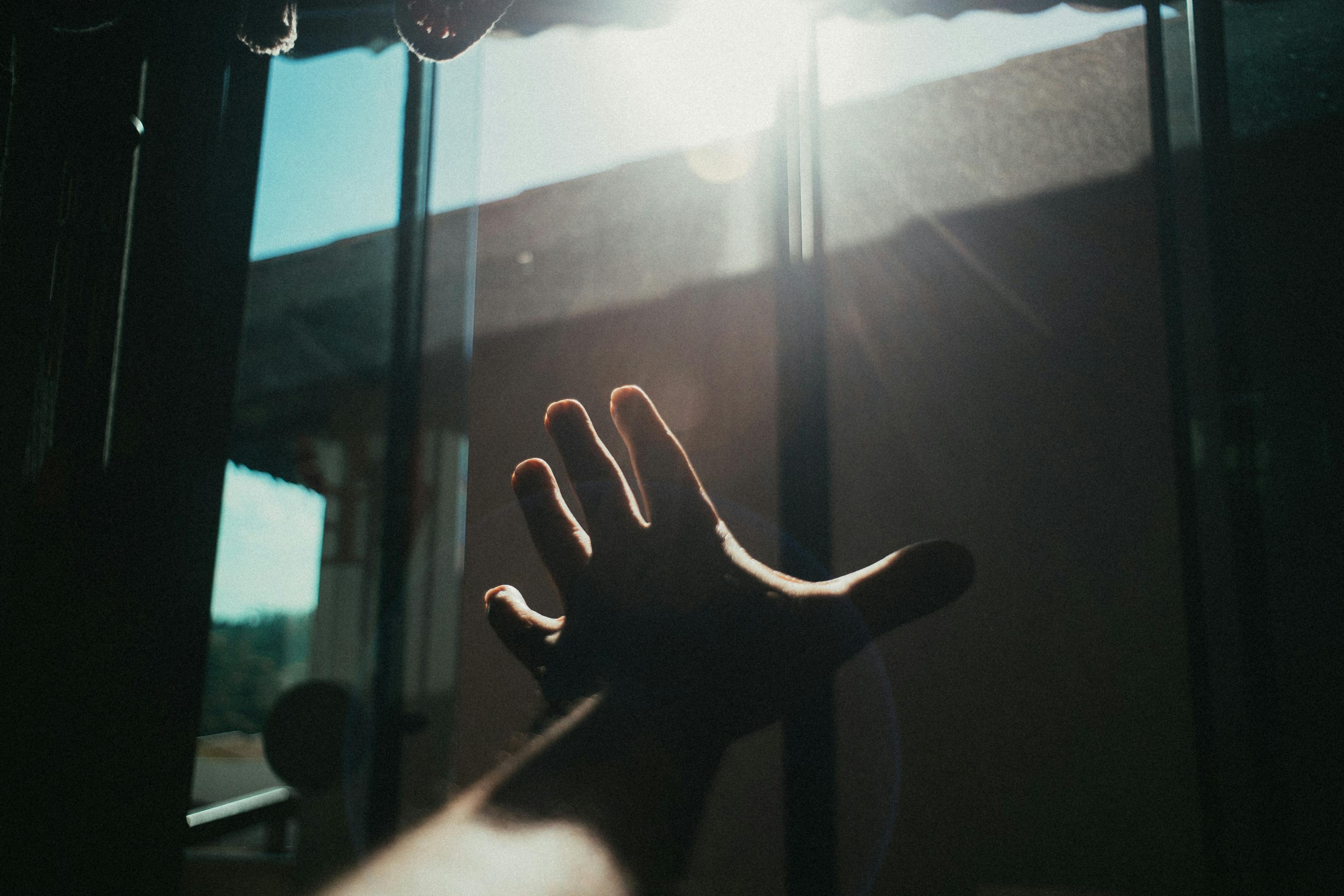Persons Hand Near Window · Free Stock Photo