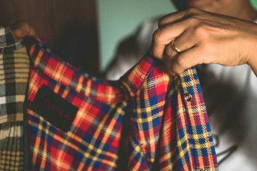 Person Holding Plaid Shirt