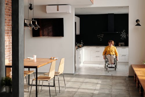 Woman in Wheelchair in Kitchen