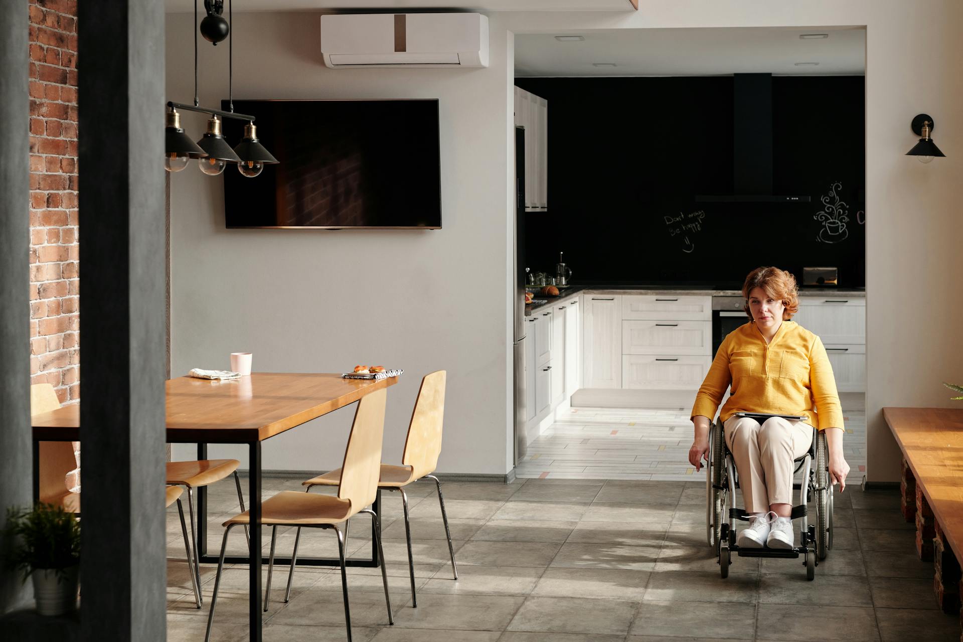 Woman Using Wheelchair at Home