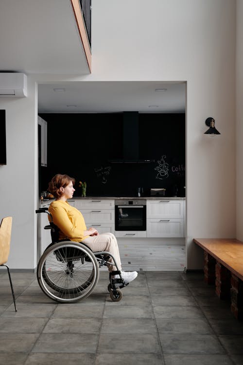 Free Woman Sitting in Wheelchair Stock Photo