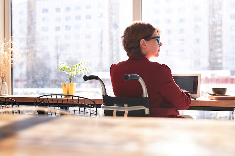 Woman In Red Long Sleeve Blazer Sitting On Wheelchair