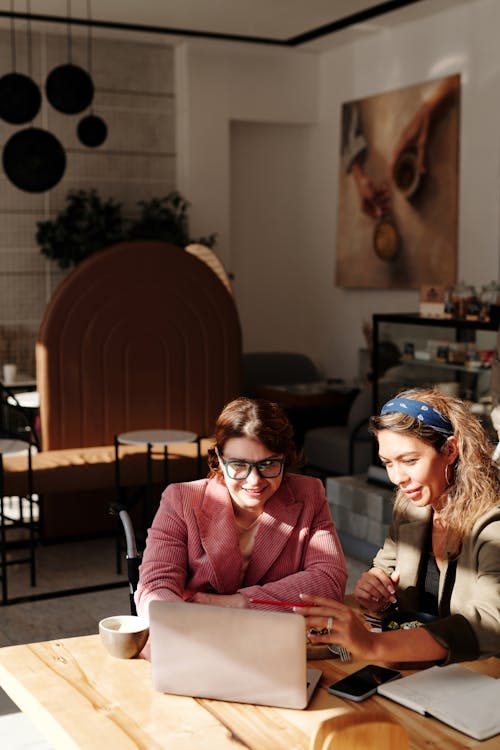 Free Women Having Meeting at the Coffee Shop Stock Photo